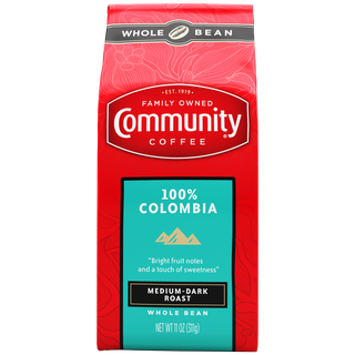 An eleven-ounce bag of whole bean Community Coffee One Hundred Percent Colombia medium-dark roast, shown from the front.
