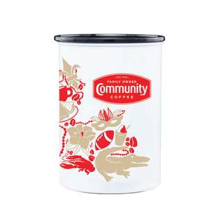 A white Airscape coffee canister bearing the red Community Coffee logo and illustrations of Louisiana icons, like gators and Mardi Gras beads.