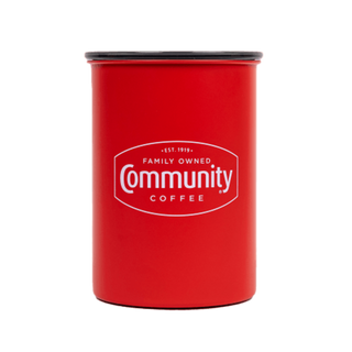 An Airscape coffee canister bearing the Community Coffee logo in white text, shown from the front.