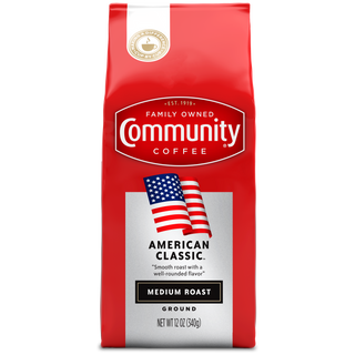 A twelve-ounce bag of ground Community Coffee American Classic medium roast, shown from the front.