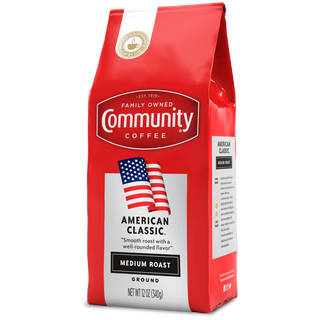 A twelve-ounce bag of ground Community Coffee American Classic medium roast, rotated a quarter-turn to the left.