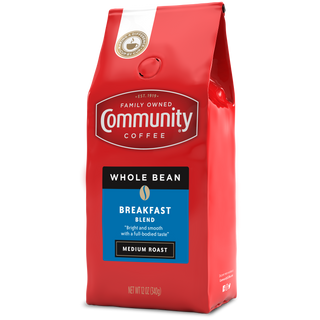 A twelve-ounce bag of whole bean Community Coffee Breakfast Blend medium roast, rotated a quarter-turn to the left.