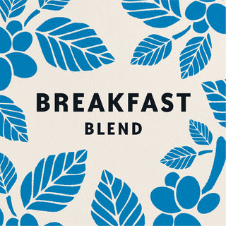 A graphic design reading BREAKFAST BLEND, surrounded by illustrations of blue coffee plants on a cream background.