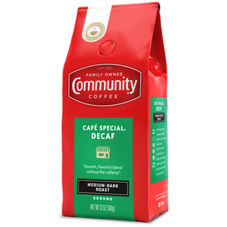 A twelve-ounce bag of ground Community Coffee Café Special Decaf medium-dark roast, rotated a quarter-turn to the left.