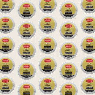 Rows of K-Cup lids for Community Coffee Café Special medium-dark roast lie flat against a white background.