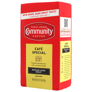 A sixteen-ounce bag of ground, vacuum-sealed Community Coffee Café Special medium-dark roast, rotated a quarter-turn to the left.