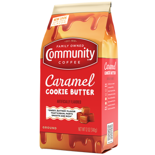 A twelve-ounce bag of ground Community Coffee Caramel Cookie Butter flavored coffee, rotated a quarter-turn to the left.