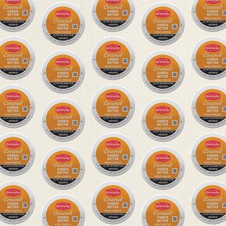 Rows of K-Cup lids for Community Coffee Caramel Cookie Butter flavored coffee lie flat against a white background.