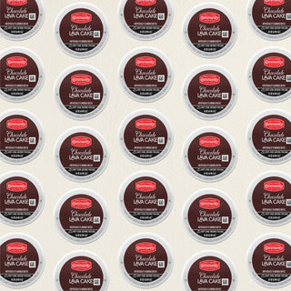Rows of K-Cup lids for Community Coffee Chocolate Lava Cake flavored coffee lie flat against a white background.