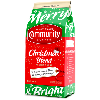 A twelve-ounce bag of ground Community Coffee Christmas Blend medium roast, rotated a quarter-turn to the left.