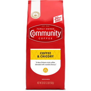 A twenty-ounce bag of ground Community Coffee, Coffee and Chicory, shown from the front.
