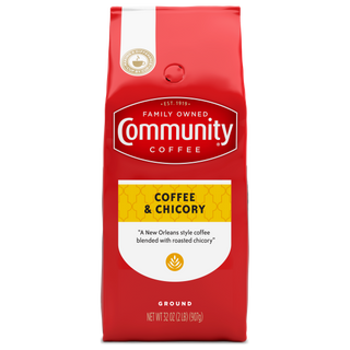 A thirty-two-ounce bag of ground Community Coffee, Coffee and Chicory, shown from the front.