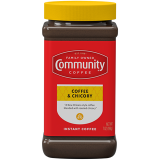 A seven-ounce jar of instant Community Coffee, Coffee and Chicory, shown from the front.