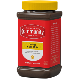 A seven-ounce jar of instant Community Coffee, Coffee and Chicory, rotated a quarter-turn to the left.