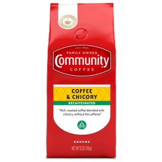 A twelve-ounce bag of ground Community Coffee, Coffee and Chicory Decaffeinated, shown from the front.
