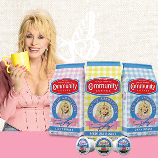 Dolly Parton smiles while holding a yellow coffee mug, next to three bags and three K-Cup pods of Cup of Ambition coffee.