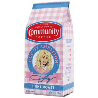 A twelve-ounce bag of Cup of Ambition Light Roast ground coffee, crafted in partnership between Dolly Parton and Community Coffee, rotated a quarter-turn to the left.