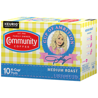 A ten-count box of Cup of Ambition Medium Roast coffee K-Cups, crafted in partnership between Dolly Parton and Community Coffee, rotated a quarter-turn to the left.