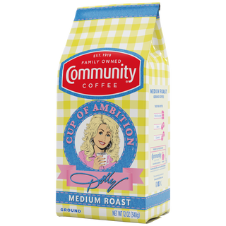 A twelve-ounce bag of Cup of Ambition Medium Roast ground coffee, crafted in partnership between Dolly Parton and Community Coffee, rotated a quarter-turn to the left.