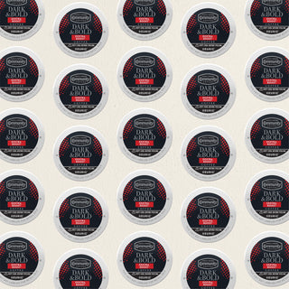 Rows of K-Cup lids for Community Coffee Dark and Bold Exxtra Boost lie flat against a white background.