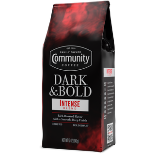 A twelve-ounce bag of ground Community Coffee Dark & Bold Intense Blend, rotated a quarter-turn to the left.