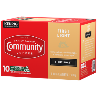 A ten-count box of Community Coffee First Light, light roast K-Cups, rotated a quarter-turn to the left.