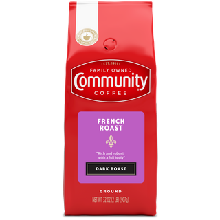 A thirty-two-ounce bag of ground Community Coffee French Roast dark roast, shown from the front.