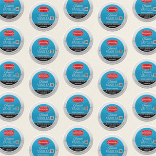 Rows of K-Cup lids for Community Coffee French Vanilla flavored coffee lie flat against a white background.