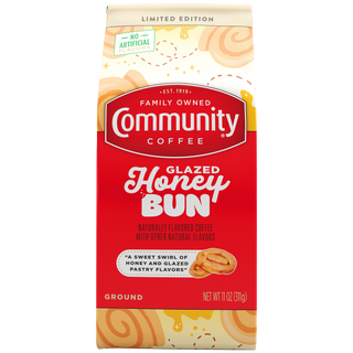An eleven-ounce bag of ground Community Coffee Glazed Honey Bun flavored coffee, shown from the front.