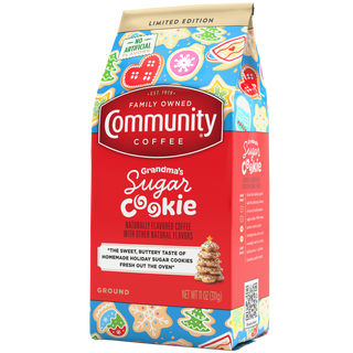 An eleven-ounce bag of ground Community Coffee Grandma's Sugar Cookie flavored coffee, rotated a quarter-turn to the left.