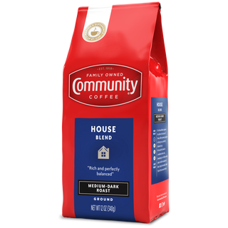 A twelve-ounce bag of ground Community Coffee House Blend medium-dark roast, rotated a quarter-turn to the left.