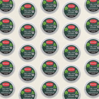 Rows of K-Cup lids for Community Coffee Irish Cream flavored coffee lie flat against a white background.
