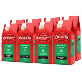 A set of eight ground Community Coffee Café Special Decaf medium-dark roast twelve-ounce bags, rotated a quarter-turn to the left and bundled for the Military Match program.
