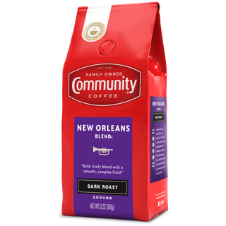 A twelve-ounce bag of ground Community Coffee New Orleans Blend dark roast, rotated a quarter-turn to the left.