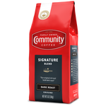 A twelve-ounce bag of ground Community Coffee Signature Blend dark roast, rotated a quarter-turn to the left.
