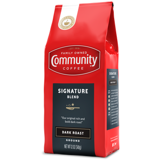 A twelve-ounce bag of ground Community Coffee Signature Blend dark roast, rotated a quarter-turn to the left.