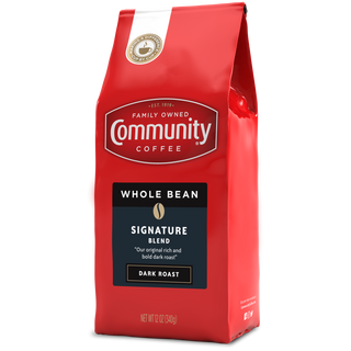 A twelve-ounce bag of whole bean Community Coffee Signature Blend dark roast, rotated a quarter-turn to the left.