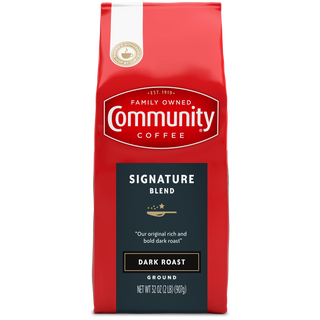 A thirty-two-ounce bag of ground Community Coffee Signature Blend dark roast, shown from the front.