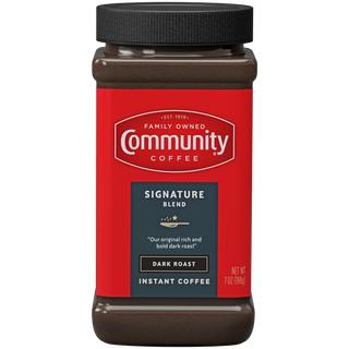 A seven-ounce jar of instant Community Coffee Signature Blend dark roast, shown from the front.