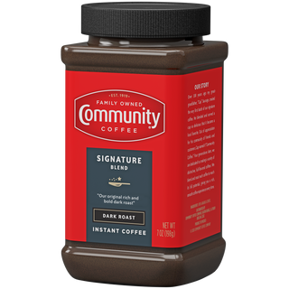 A seven-ounce jar of instant Community Coffee Signature Blend dark roast, rotated a quarter-turn to the left.