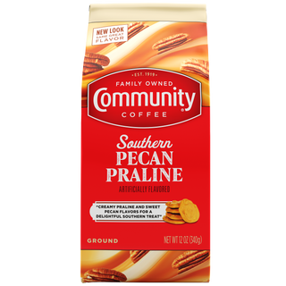 A twelve-ounce bag of ground Community Coffee Southern Pecan Praline flavored coffee, shown from the front.