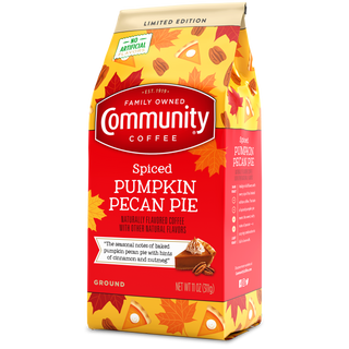 An eleven-ounce bag of ground Community Coffee Spiced Pumpkin Pecan Pie flavored coffee, rotated a quarter-turn to the left.