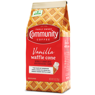 An eleven-ounce bag of ground Community Coffee Vanilla Waffle Cone flavored coffee, rotated a quarter-turn to the left.